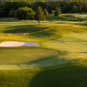 view of golf course hole with bunkers